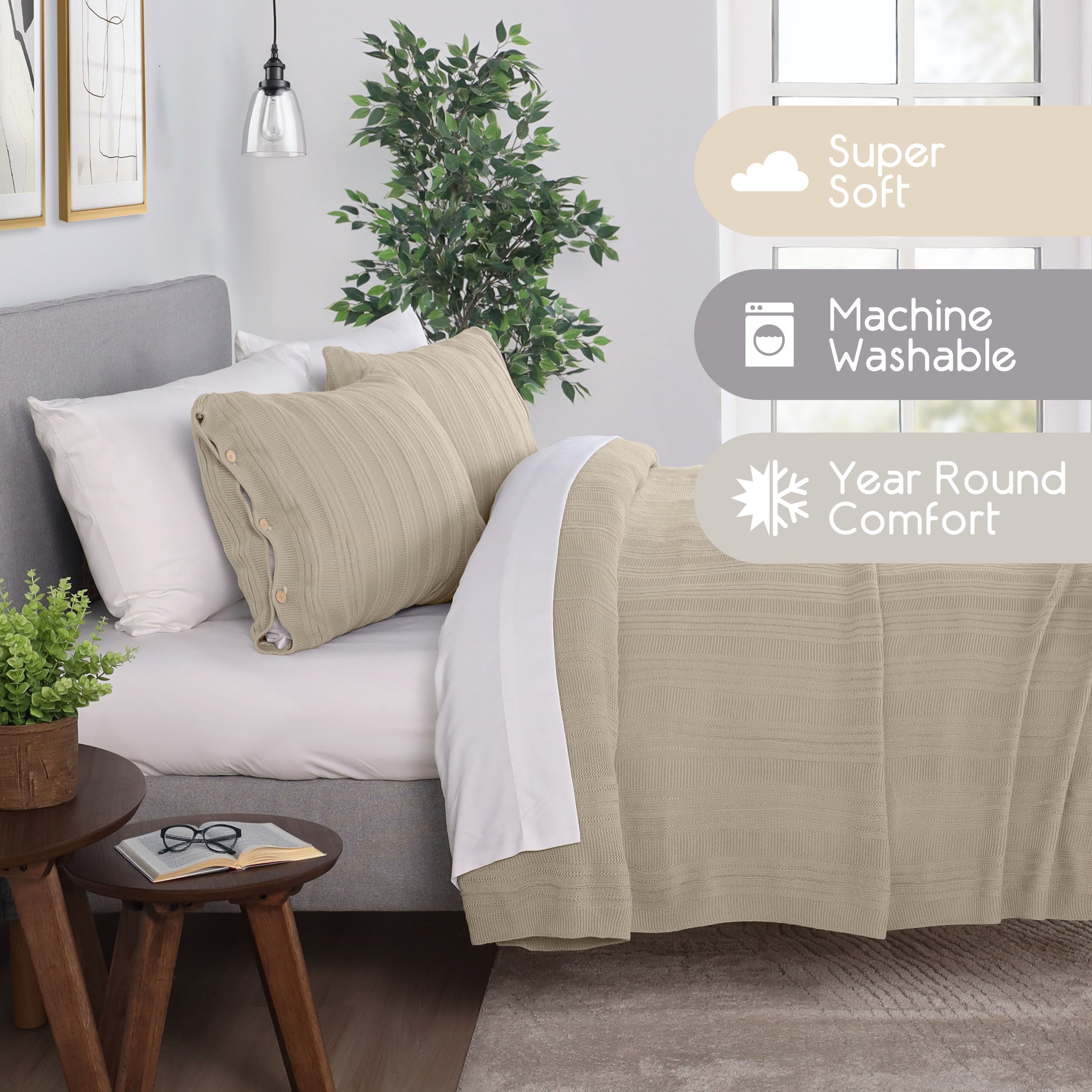 Beige blanket set with textured design, two pillows, and a plant on a bedside table in a cozy bedroom setting.