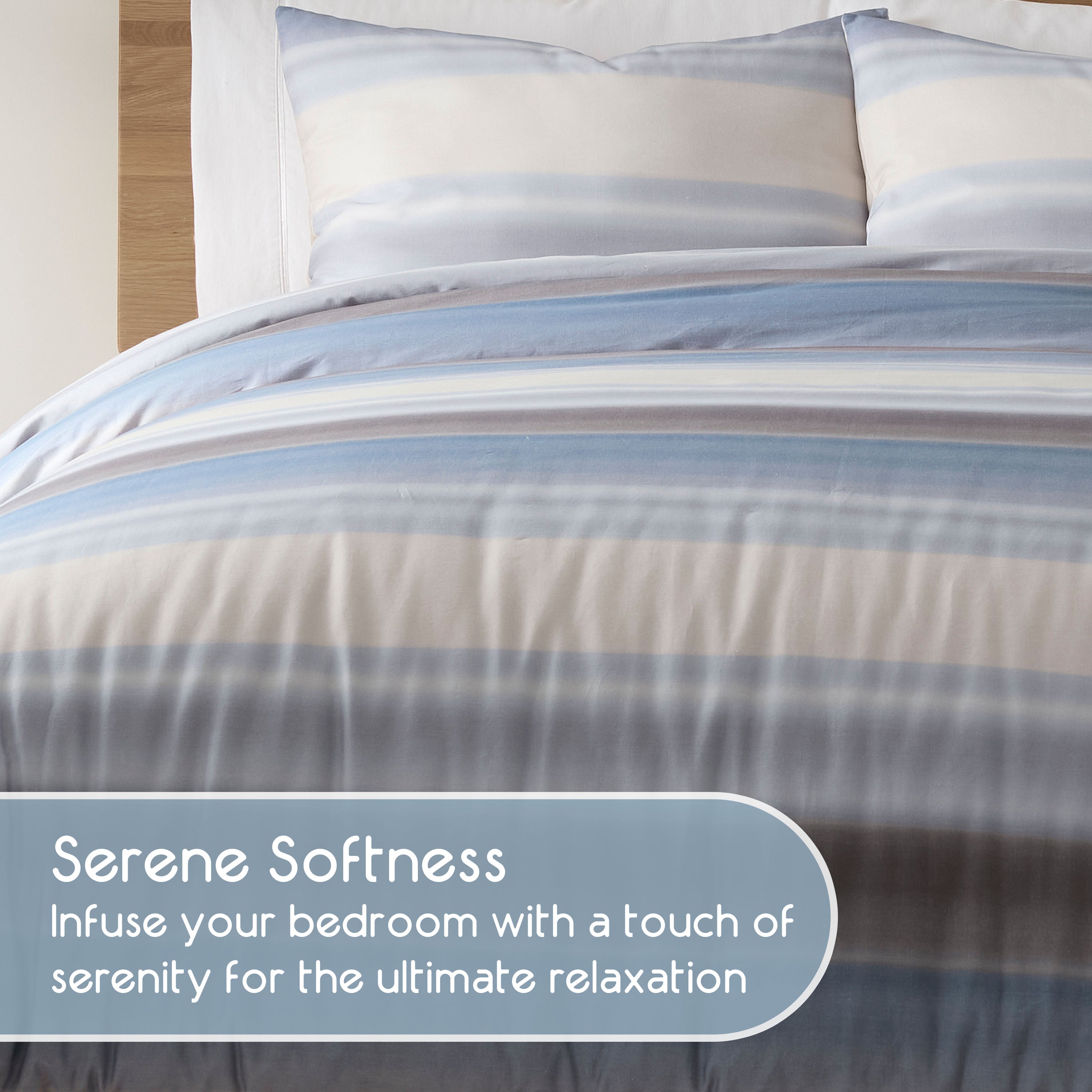 Comforter set featuring soft fabric with blue and gray horizontal stripes, accompanied by matching pillowcases.