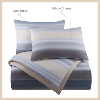 Comforter set featuring a gradient blue and beige design with matching pillow shams.