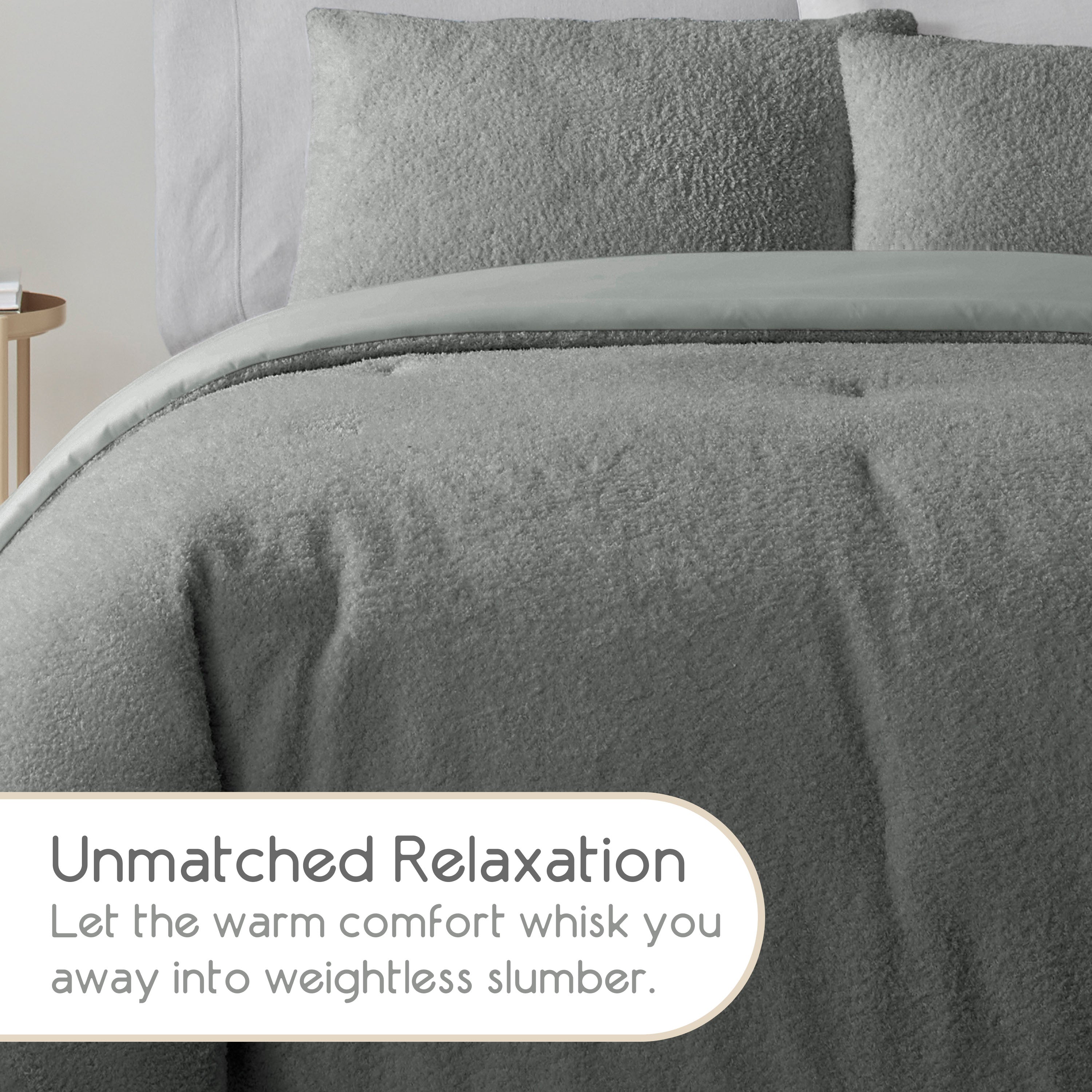 Soft gray comforter set with matching pillows on a bed, featuring a textured fabric.