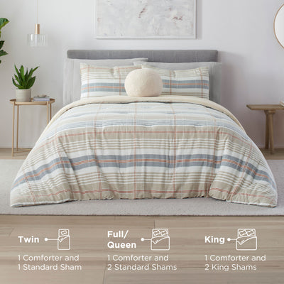 Taupe comforter set with plaid design, includes shams, displayed on a bed with a plant and side table.