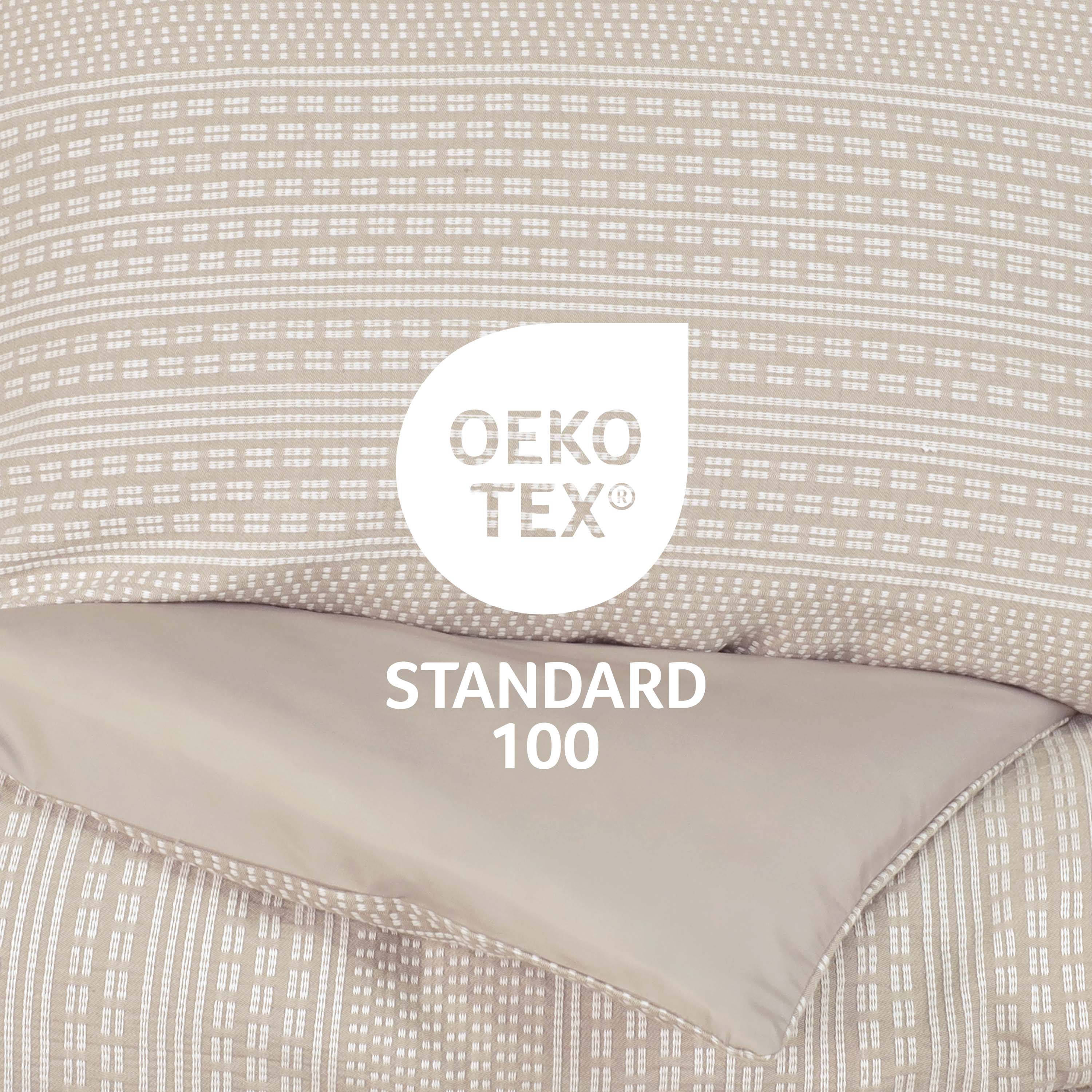 Comforter set featuring a patterned top layer in beige and a solid beige underside, with Oeko-Tex Standard 100 certification.