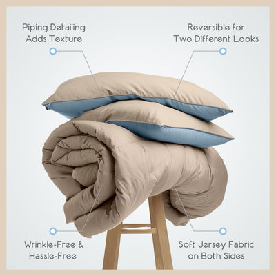Reversible comforter set with beige and blue colors, featuring soft jersey fabric and piped detailing.