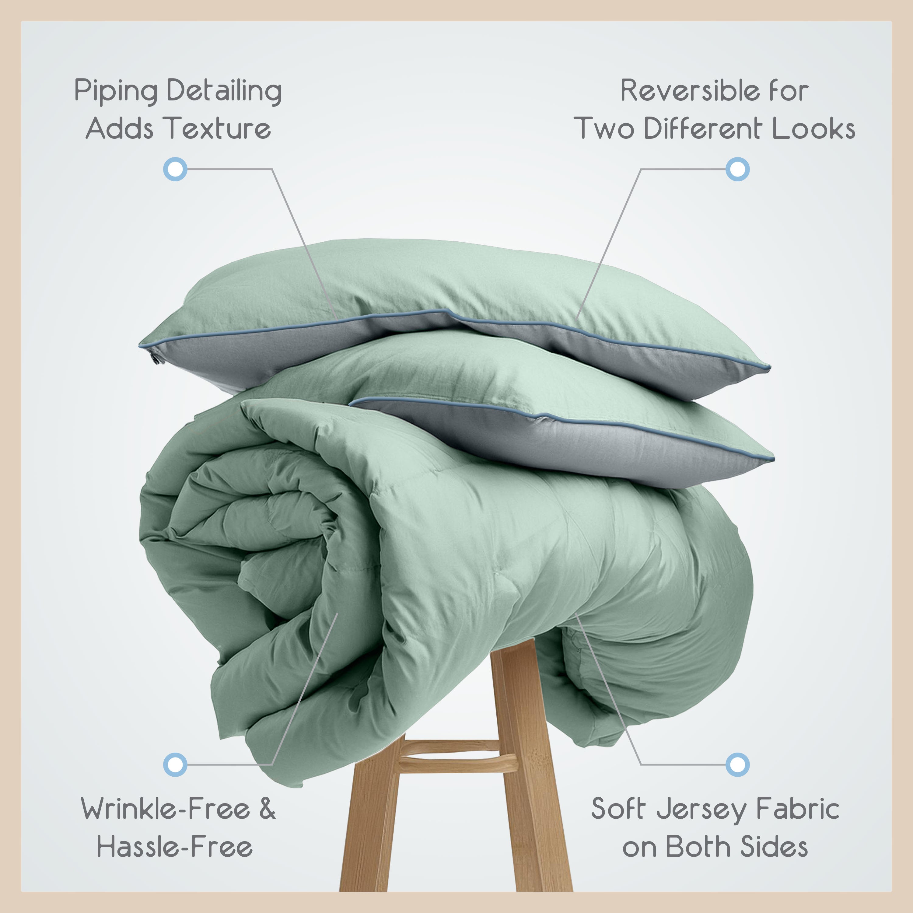 Green comforter set rolled up with two matching pillows, featuring piping detail and soft jersey fabric on both sides.