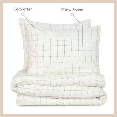 Coverlet set featuring a comforter and two pillow shams with a grid pattern on a light background.