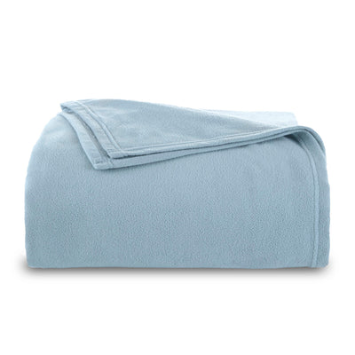 Light blue micro fleece blanket folded neatly with a smooth texture.