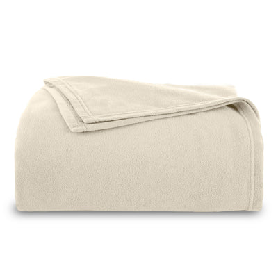Light beige micro fleece blanket folded neatly with a stitched edge.