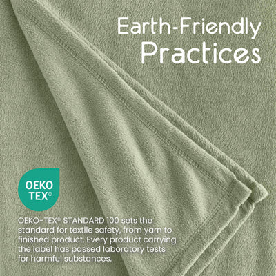Light green micro fleece blanket with a soft texture and stitched edges, featuring Oeko-Tex certification information.