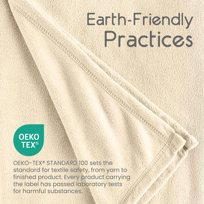 Beige micro fleece blanket with stitched edges, featuring Oeko-Tex certification for textile safety.