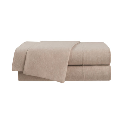 Beige sheet set stacked neatly with a soft texture and visible stitching details.