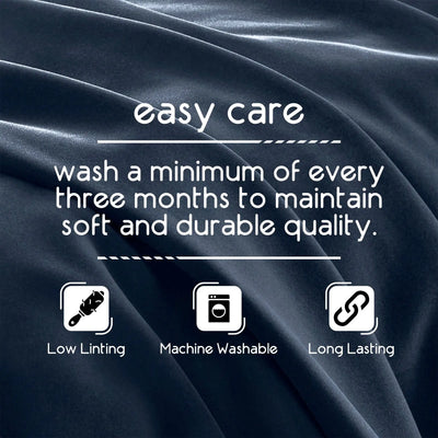 Text on fabric indicating care instructions with icons for low linting, machine washable, and long lasting.
