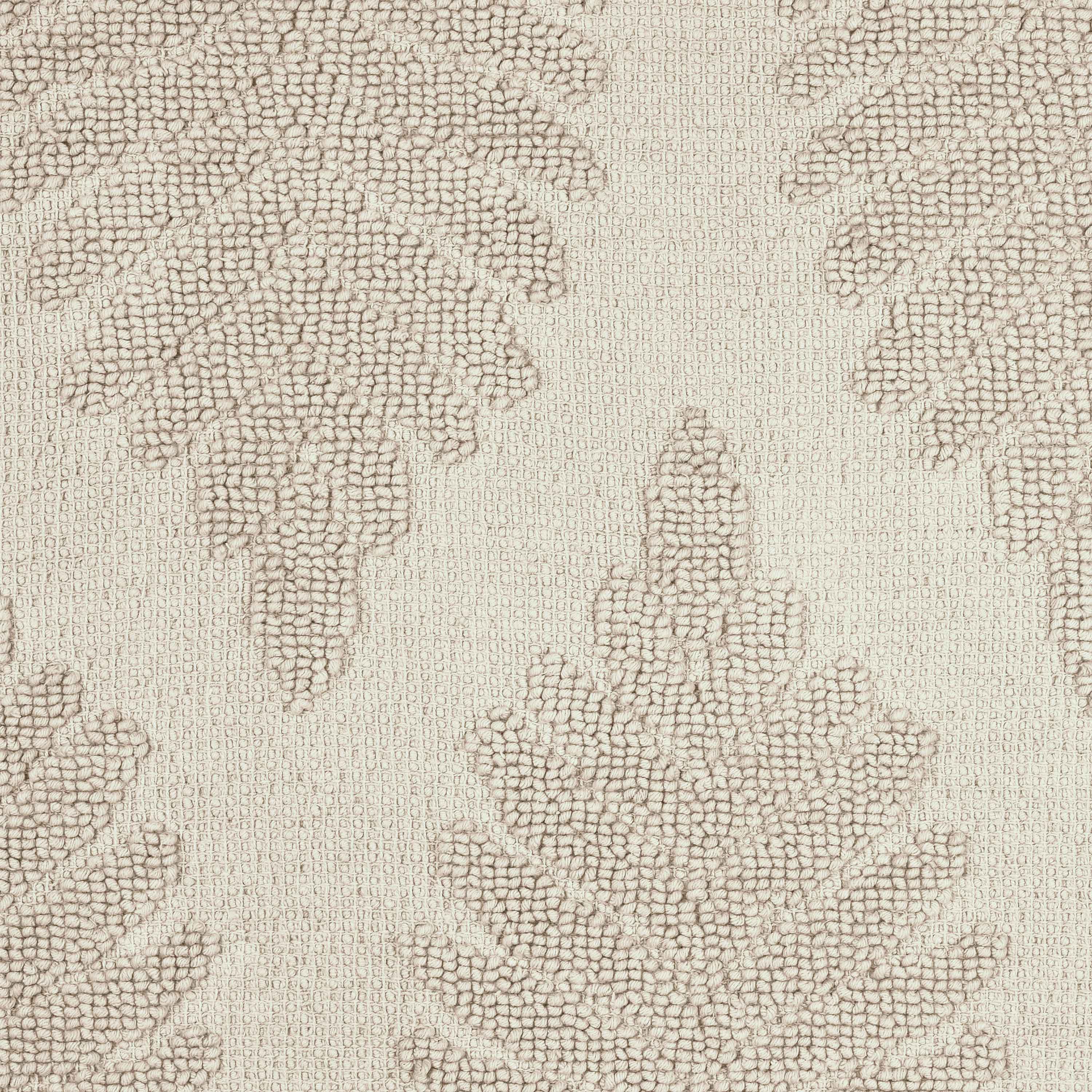 Textured bath rug featuring a fern ogee pattern in neutral tones.