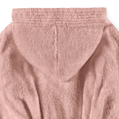 Hooded bath robe in soft pink fabric with textured detailing on the hood and body.
