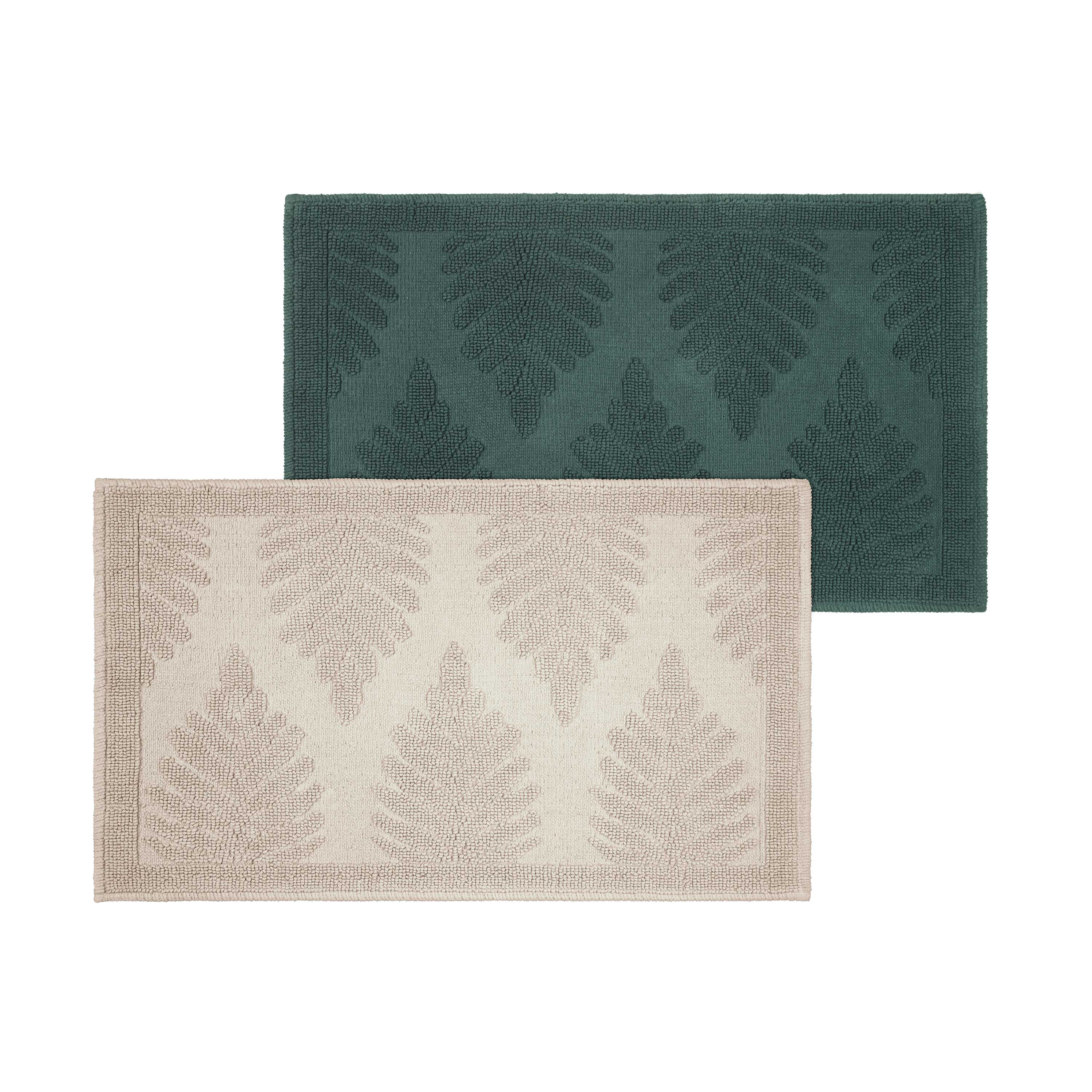 Two bath rugs featuring a fern ogee pattern, one in dark green and the other in light beige.