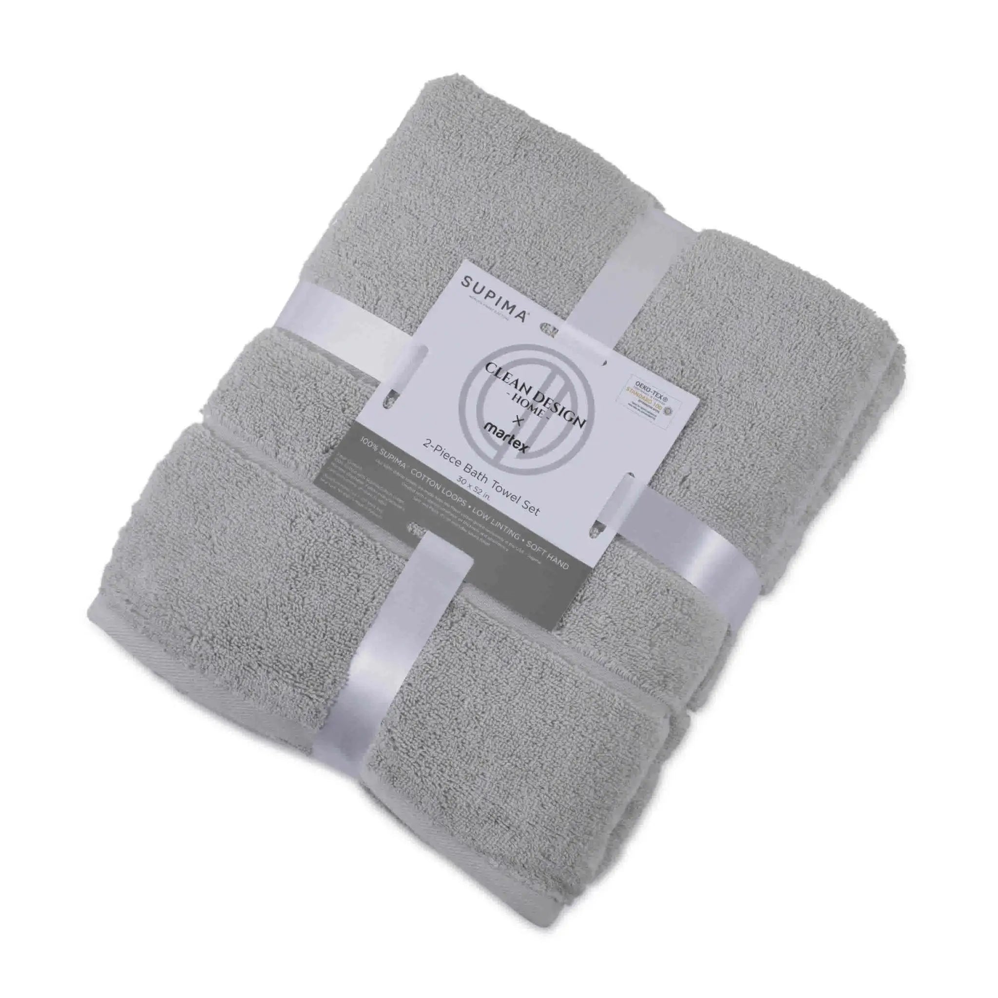Folded grey bath towel set with a label on a white background