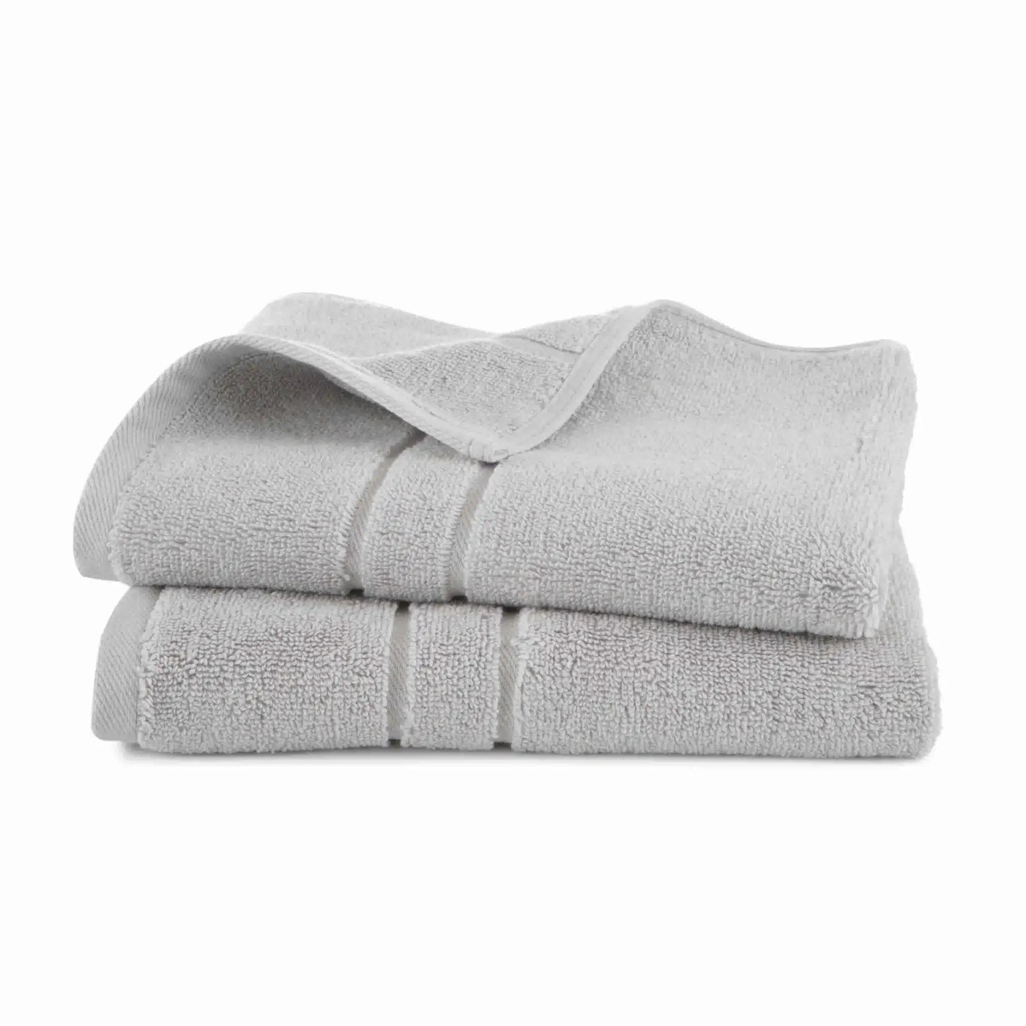 Stack of grey hand towel set on a white background