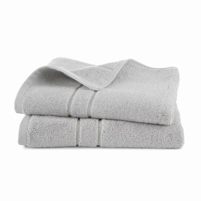 Stack of grey hand towel set on a white background