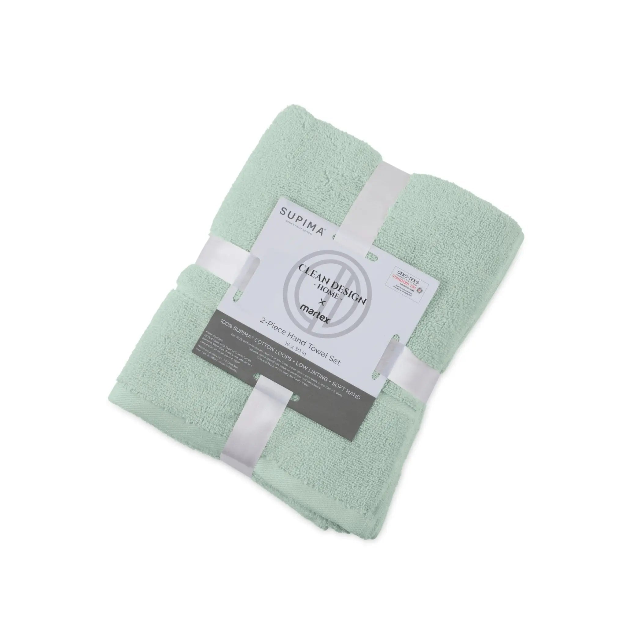A folded set of two sage terry hand towels wrapped in white ribbons with a paper label that reads 'SUPIMA' and 'Clean Design by Martex'.