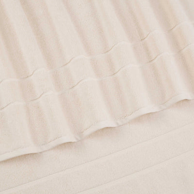 Close-up of ivory fabric with folds
