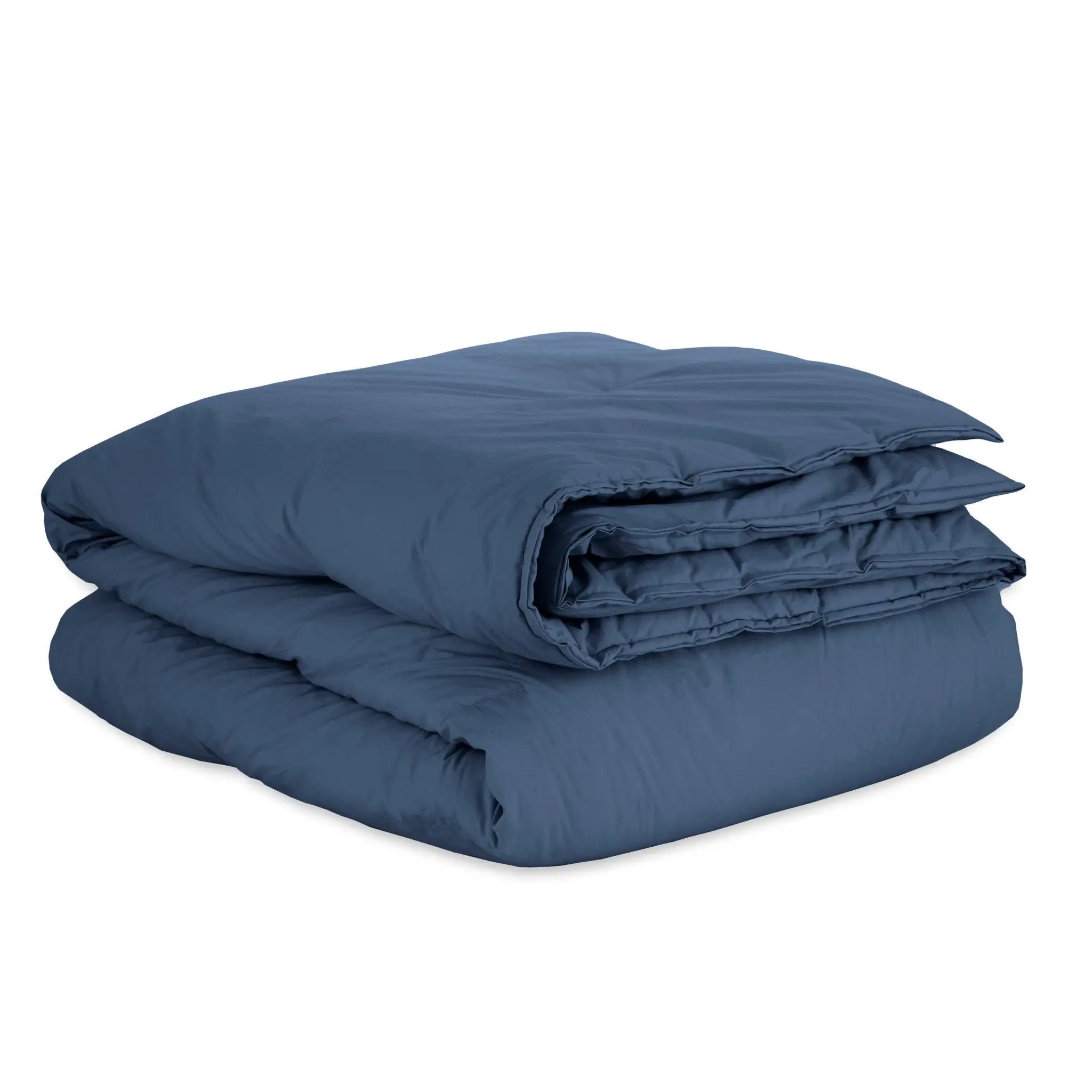 Folded navy duvet on a white background
