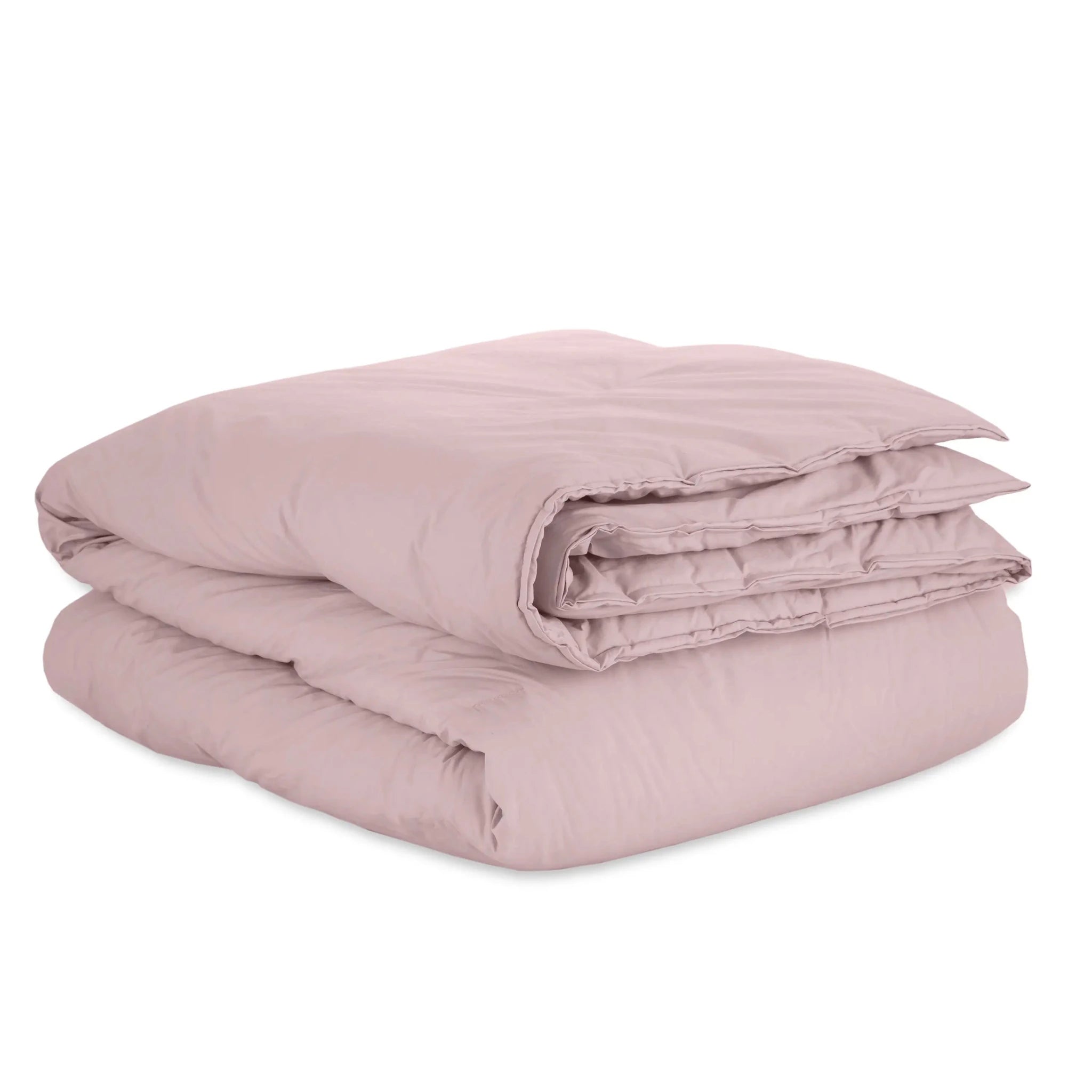 A folded pink duvet against a plain white background.