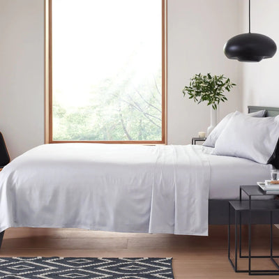 Neatly made bed in a modern bedroom.