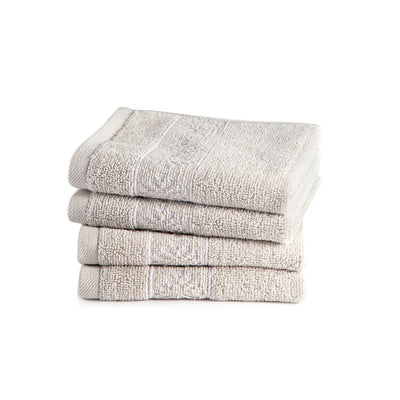 Stack of four folded wash cloths on a white background