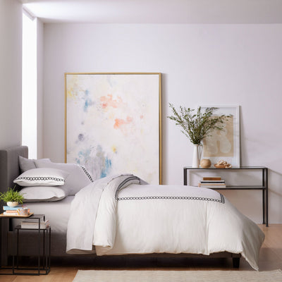 Modern bedroom with comforter set.