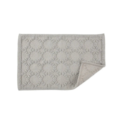 Gray textured bath rug on a white background