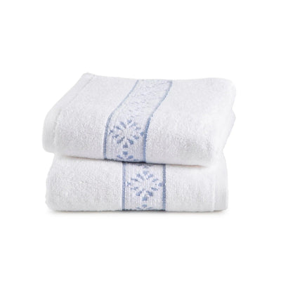 Two white hand towels with blue embroidery on a white background