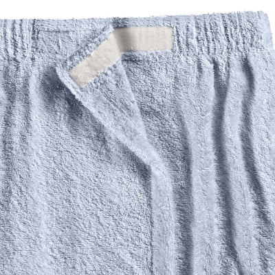 A close-up of a blue shower wrap.