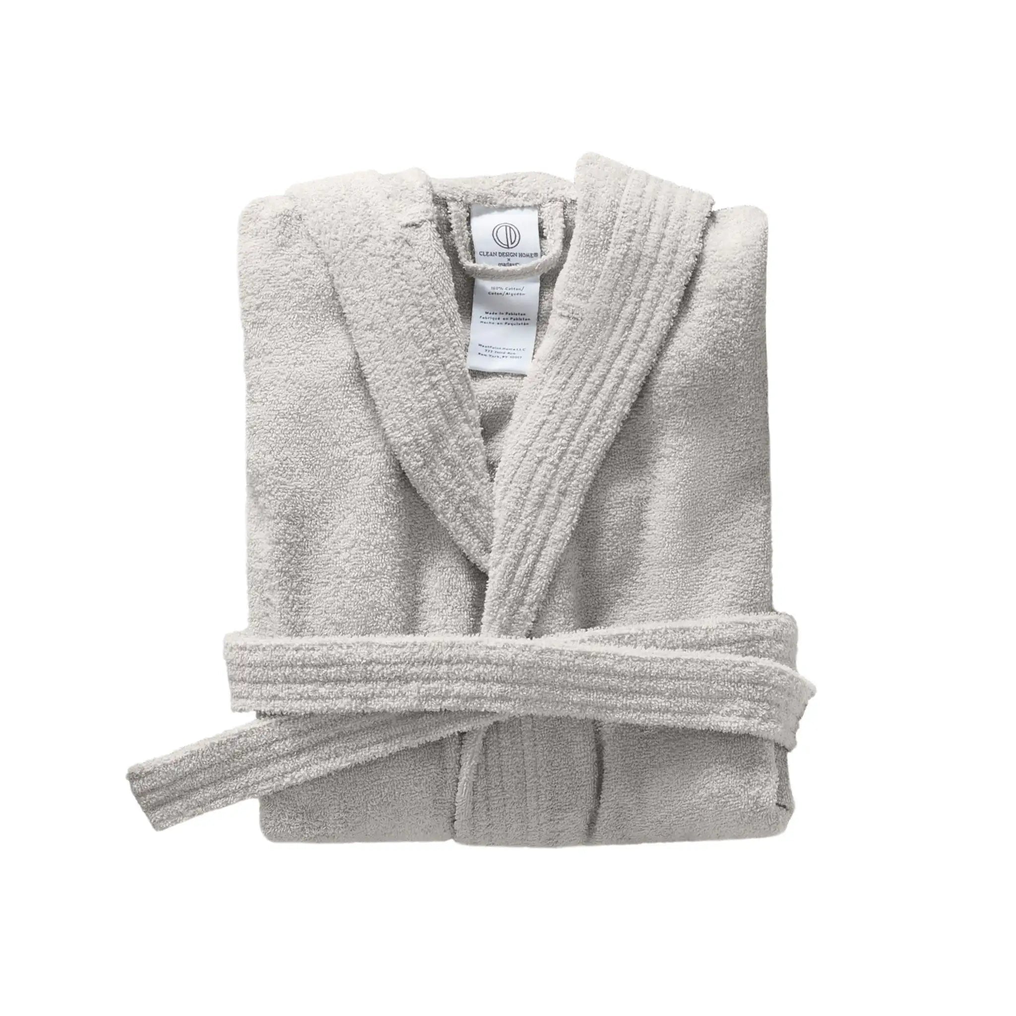 Folded gray bathrobe on a white background