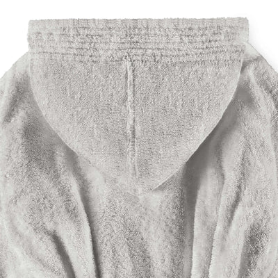 Close-up of a textured gray bath robe with a focus on its fabric and folds.