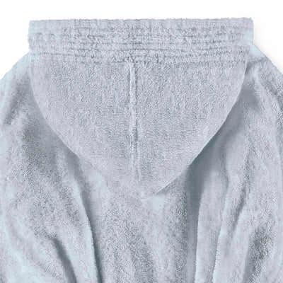 Close-up of a blue plush hooded robe or bathrobe fabric, showing the textured terry surface and hood opening against a plain white background.