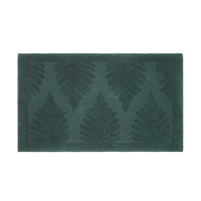 Rectangular bath rug in dark green with a textured fern leaf pattern.
