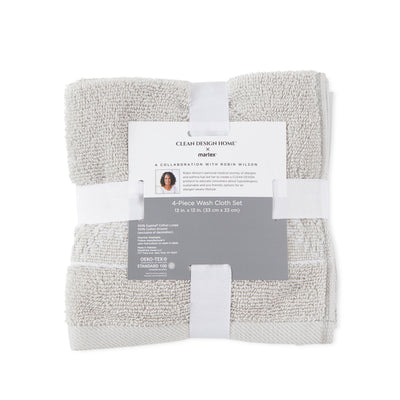 Four-piece wash cloth set in light gray, featuring a label with product details and care instructions.