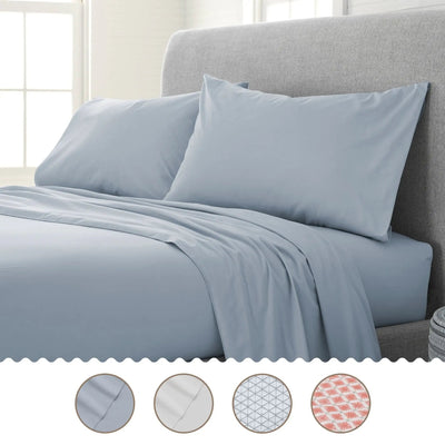 Blue bed sheets and pillows on a bed with color swatches below.