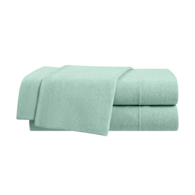 Soft mint green sheet set stacked neatly with a smooth texture.