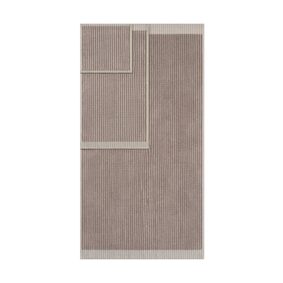 Two towels with a sculpted stripe design in a neutral color palette, featuring a contrasting border.