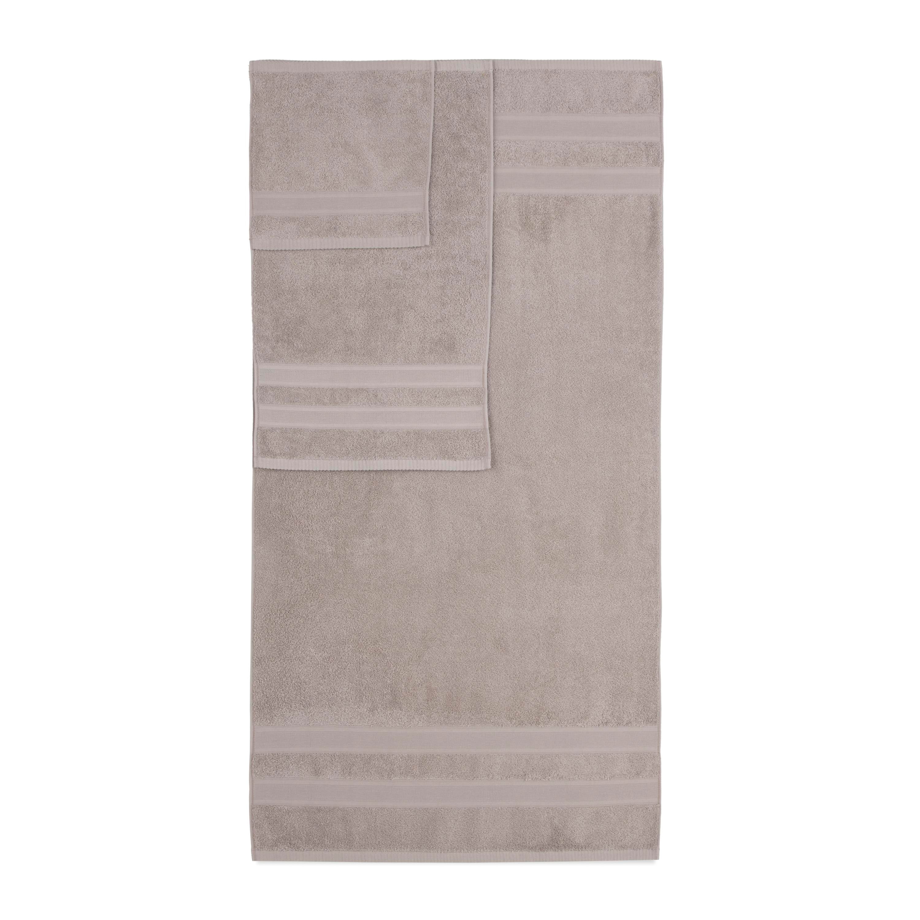 Solid beige towel set featuring a bath towel and a hand towel with decorative stripes.