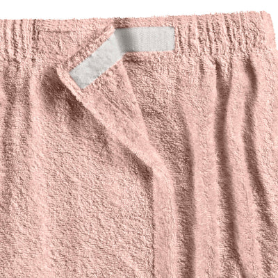 Soft pink shower wrap with a textured surface and a velcro closure at the top.