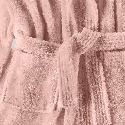 Hooded bath robe in soft pink fabric with a tied belt and front pockets.