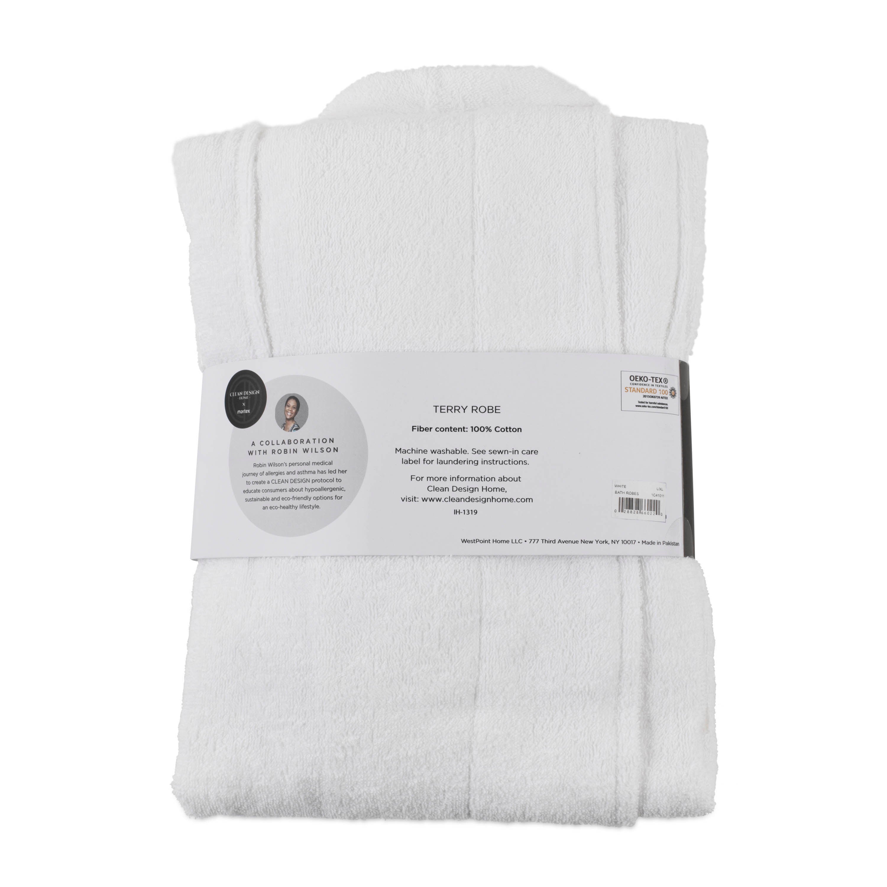 White terry bath robe folded with a care label detailing fiber content and washing instructions.