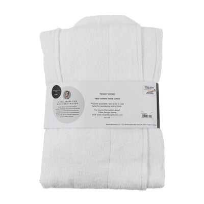 White terry bath robe folded with a care label detailing fiber content and washing instructions.