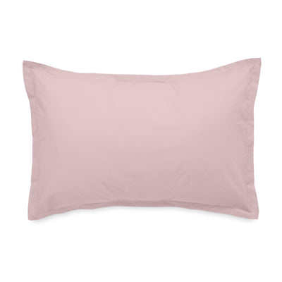 Solid light pink pillowcase with a simple, clean design and a piped edge.