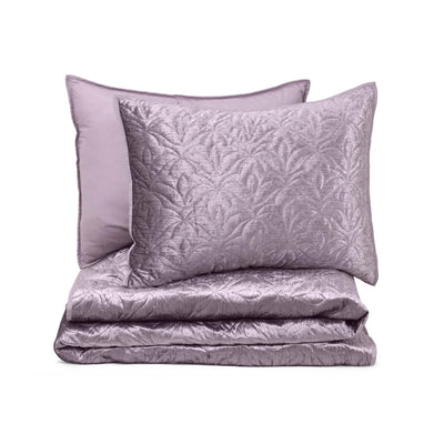 Purple textured quilt set on a white background