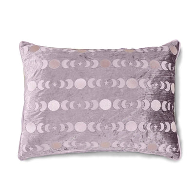 A rectangular lavender velvet pillow featuring a horizontal pattern of metallic silver and rose gold moon and star phases, shown against a plain white background.