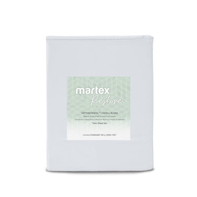 Light gray twin sheet set with a label detailing cotton and Tencel blend and features like moisture-wicking.