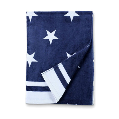 Navy blue towel with white star pattern on a white background