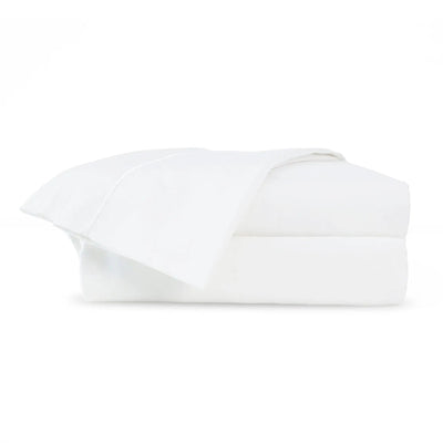 A neatly folded stack of white bedding, likely a duvet cover or comforter set, shown against a seamless white background.